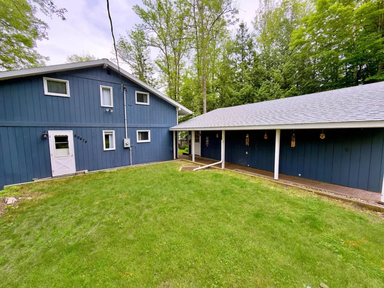 Private Hill Lake Waterfront Home with 100 Feet of Shoreline and Stunning Year-Round Views